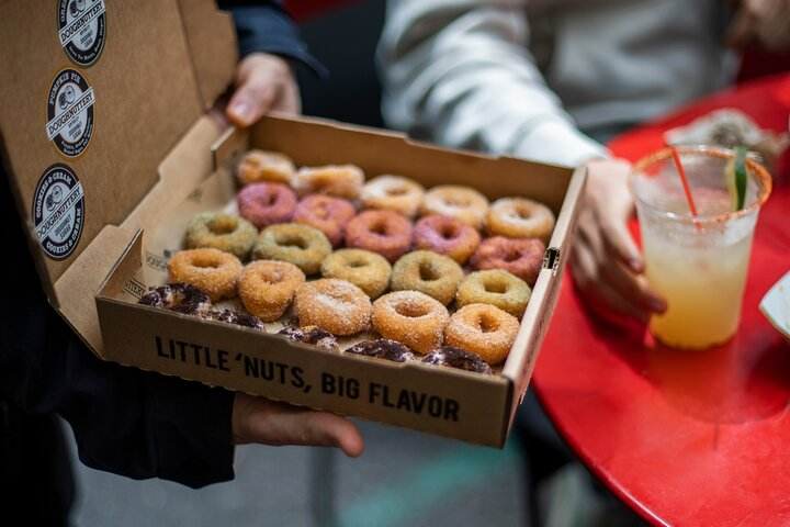 Indulge in delightful doughnuts packed with flavor as you explore Chelsea Market sampling local treats and enjoying tastes unique to New York City's culinary scene.